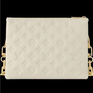 Cream colored small hand bag